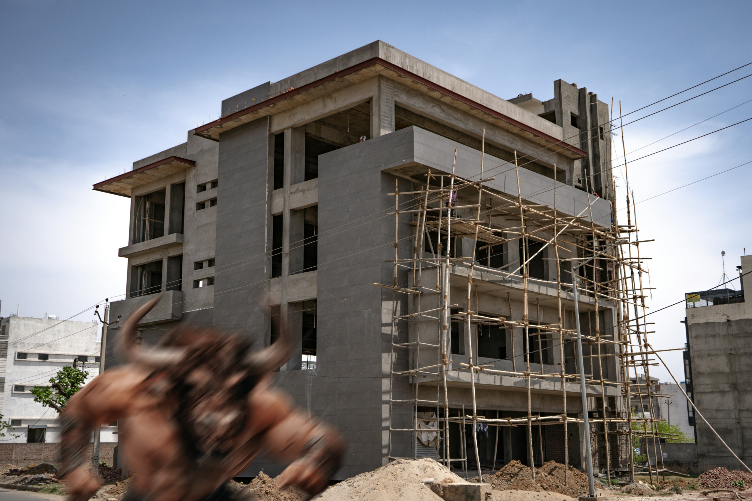 A minotaur rising from a building under construction