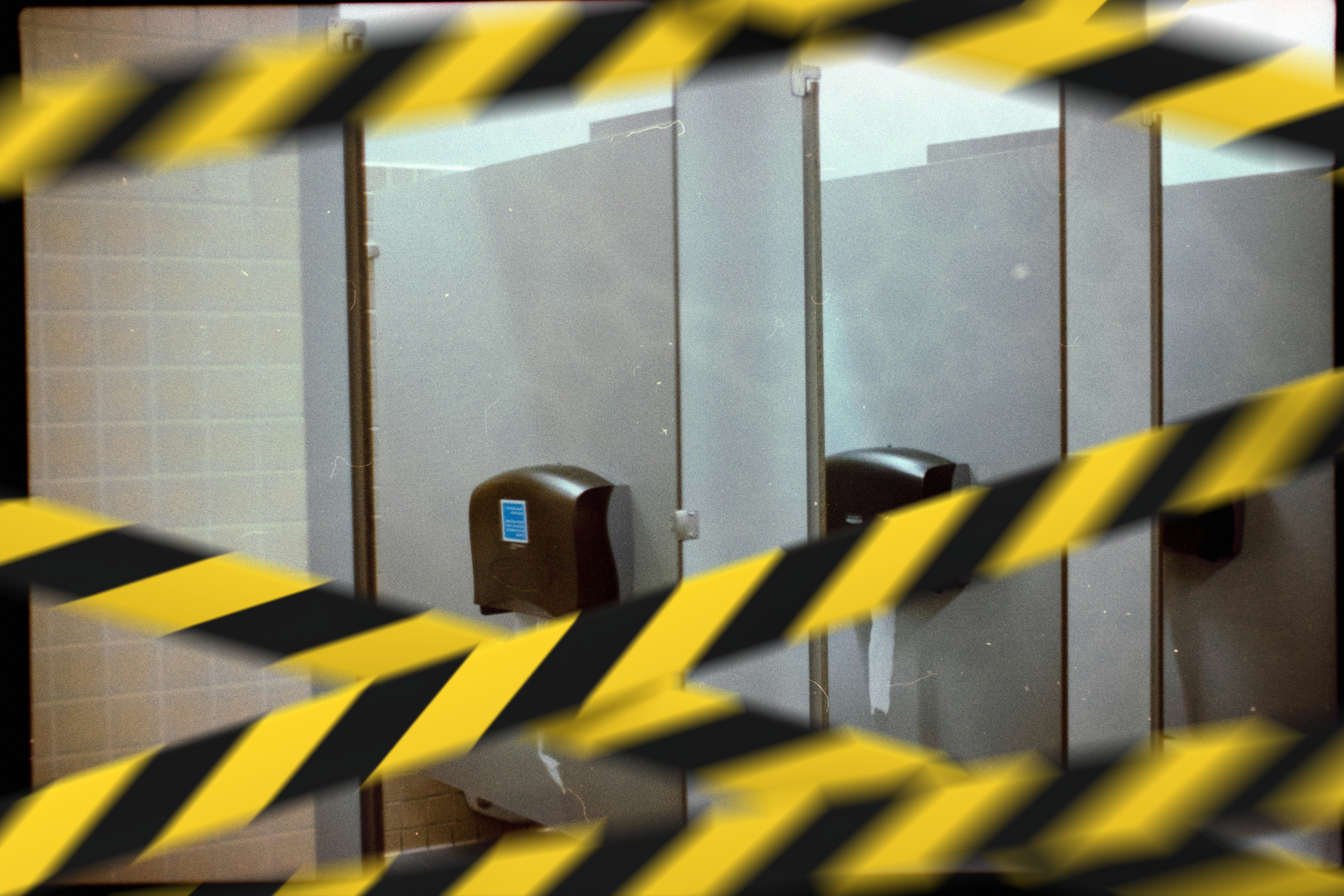 Public washroom wrapped in caution tape