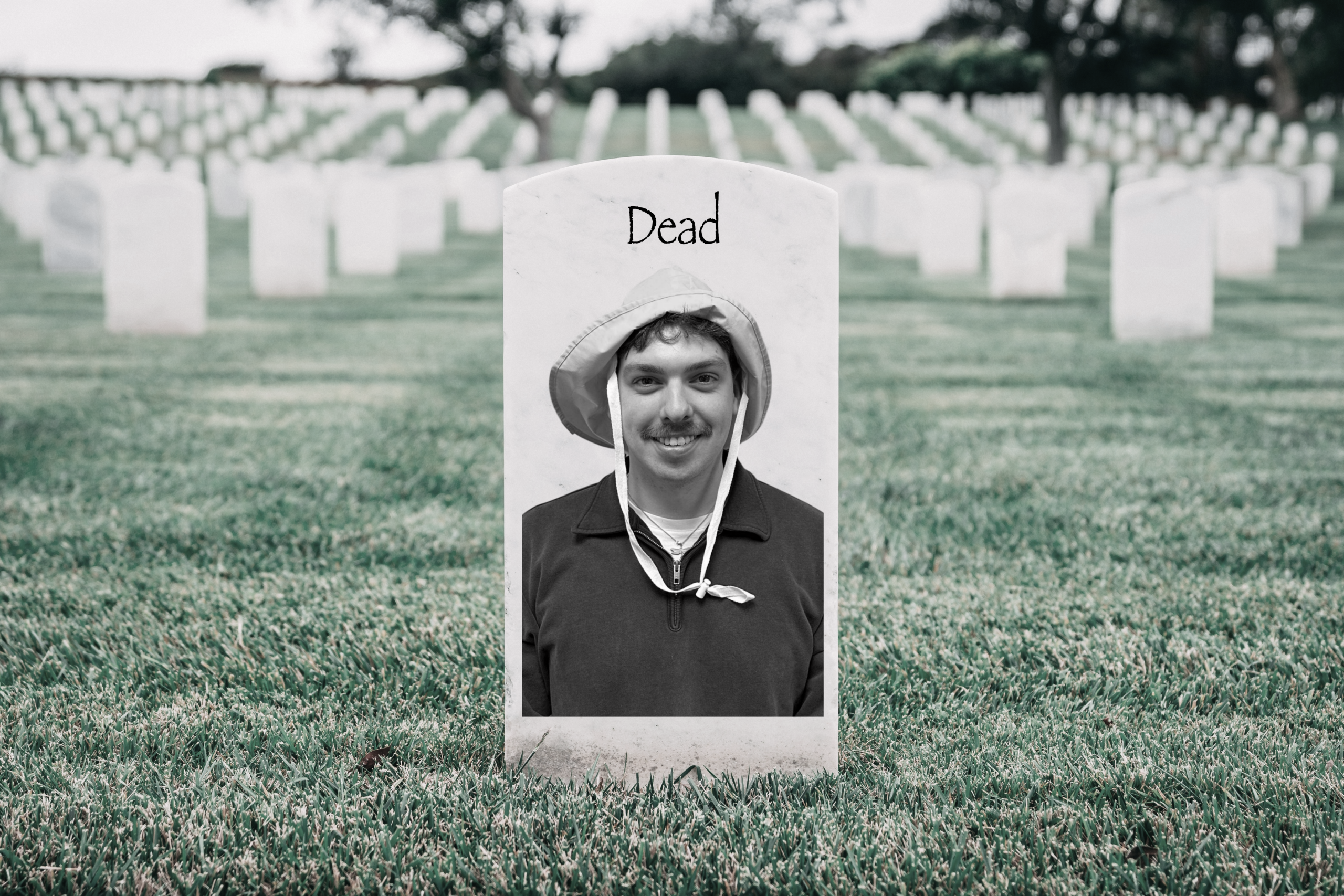 Sam Creighton's face on a tombstone with "Dead" written overtop